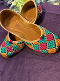 Multicolor Phulkari Embroidered Punjabi Jutti – Handcrafted Ethnic Footwear with Vibrant Threadwork & Pom-Pom Detailing