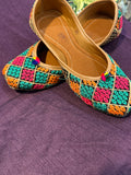 Multicolor Phulkari Embroidered Punjabi Jutti – Handcrafted Ethnic Footwear with Vibrant Threadwork & Pom-Pom Detailing