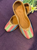 Multicolor Thread Embroidered Punjabi Jutti – Handcrafted Ethnic Footwear with Striped Design & Pom-Pom Detailing